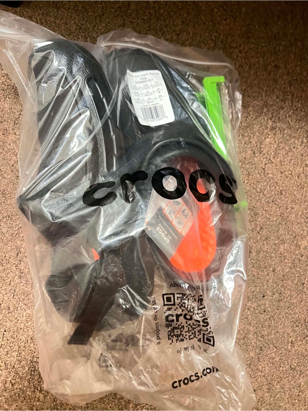 CROCS Black Clogs with Orange Insole and Green Tag